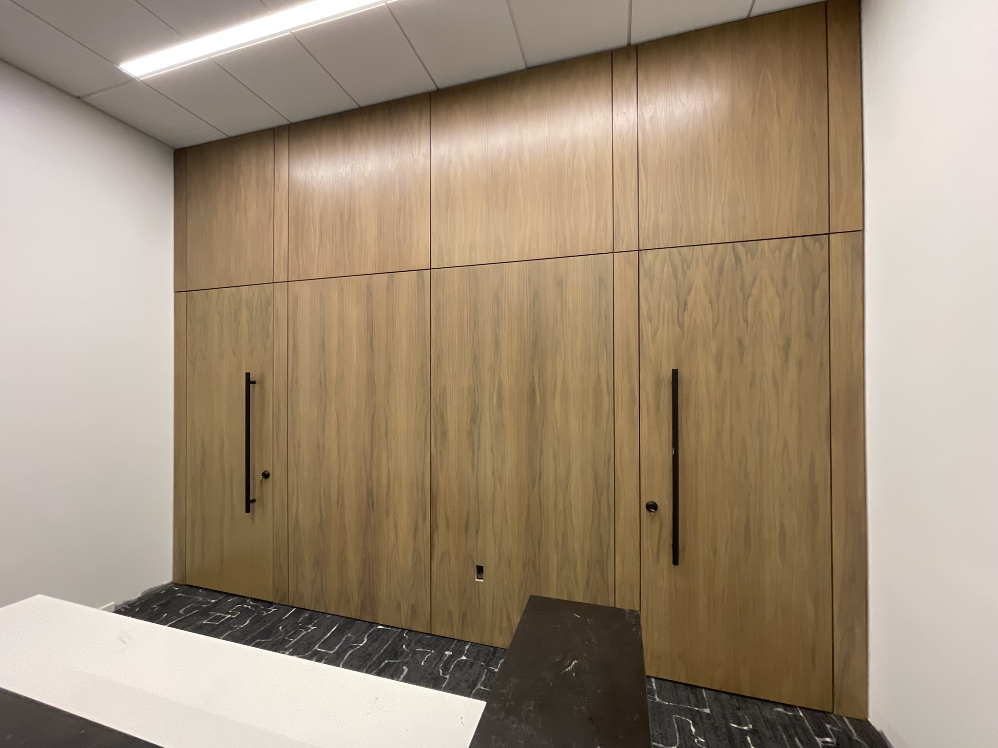 Commercial cabinetry and wood wall panel installation