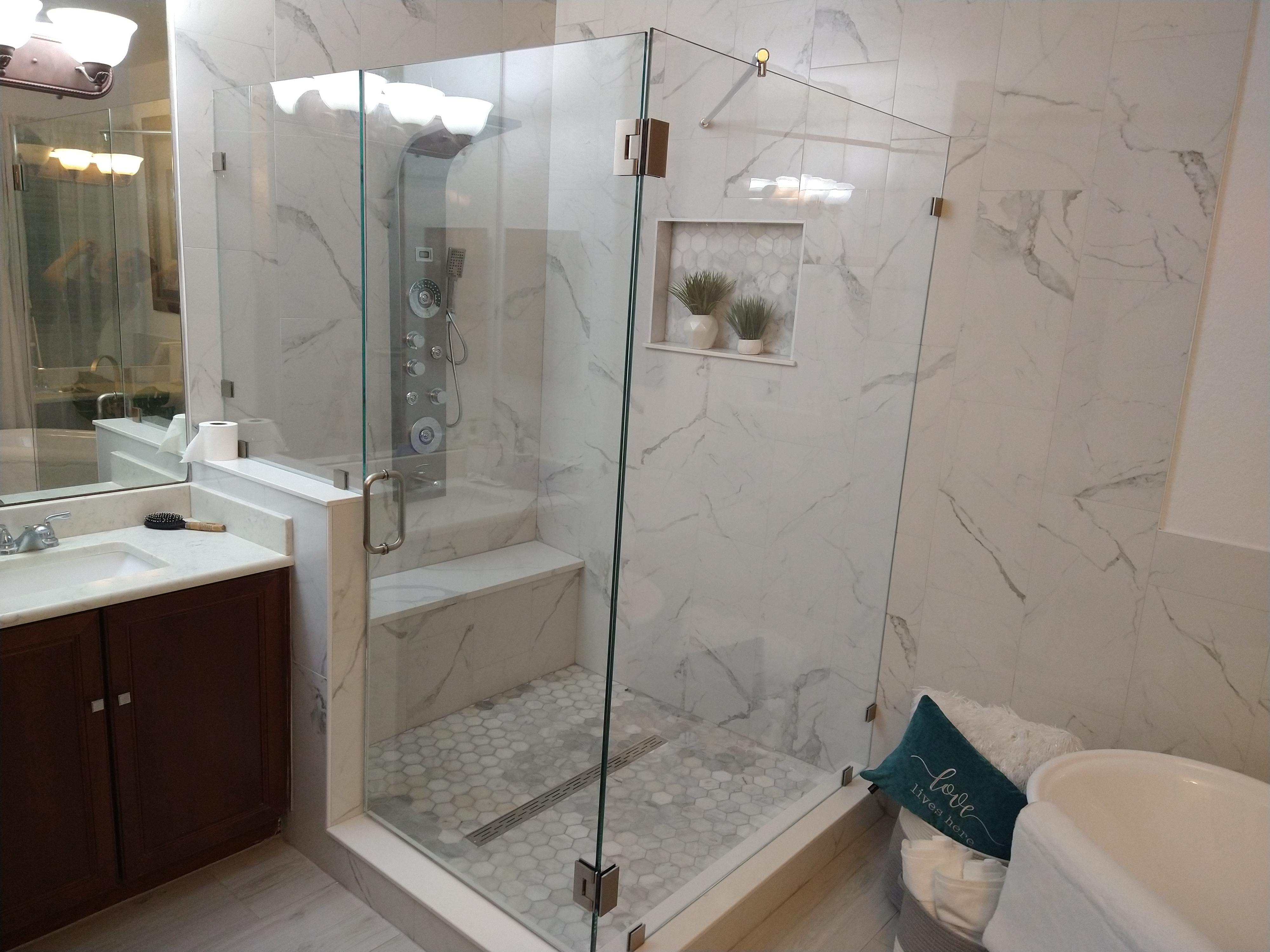 Frameless glass shower installation by St. Cloud Pro-Services LLC